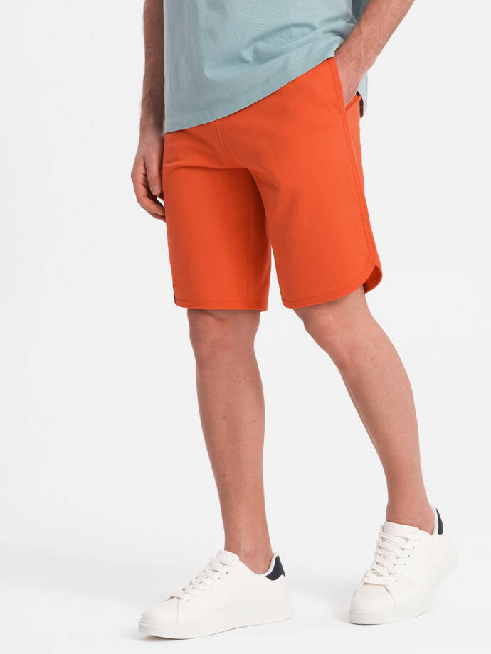 Pánske teplákové šortky so zaoblenými nohavicami - oranžové V5 OM-SRSK-0105